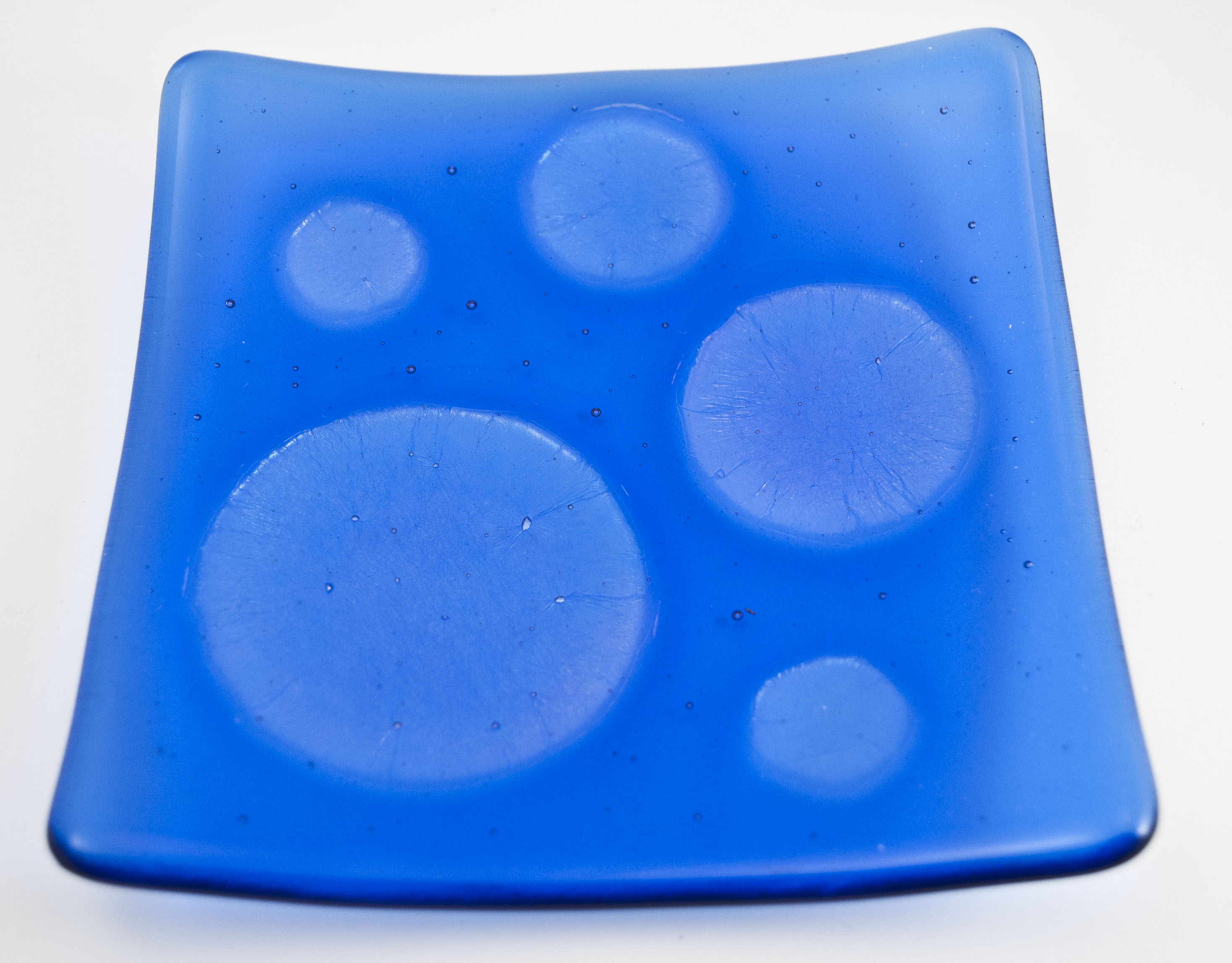 Blue dish with clear irid circles